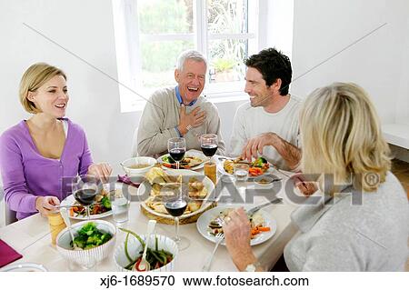 Stock Image - Family at the dinner table. Fotosearch