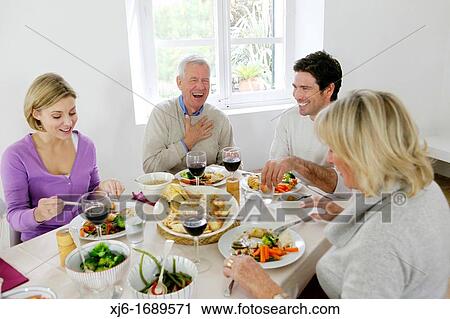 Stock Image - Family at the dinner table. Fotosearch