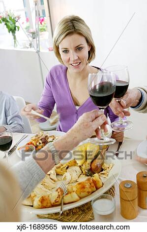 Stock Photography - Family at the dinner table. Fotosearch