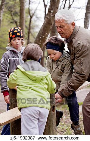 Stock Photo - Family at the playground.. Fotosearch