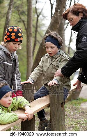 Stock Photo - Family at the playground.. Fotosearch