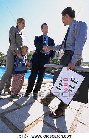 Stock Photo - Family buying new house. Fotosearch