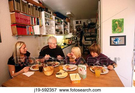 Family diner at home (children 5 and 14). Stockholm. Sweden. View Large Photo Image Stock Photo - Family diner at home (children 5 and 14). Stockholm. Sweden.. Fotosearch