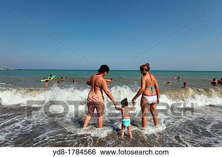 Family enjoying the beach, Spain, Andalucia, Spain View Large Photo Image Stock Photograph - Family enjoying the beach, Spain, Andalucia, Spain. Fotosearch
