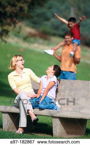 Family enjoys a day outdoors View Large Photo Image Stock Photo - Family enjoys a day outdoors. Fotosearch