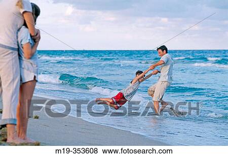 family fun at the beach View Large Photo Image Stock Photo - family fun at the beach. Fotosearch