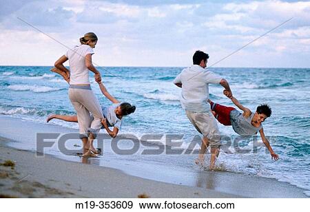 Stock Photo - family fun at the beach. Fotosearch