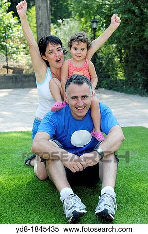 Stock Photography - Family funny looking at the camera, Barcelona, Catalonia, Spain, Europe. Fotosearch