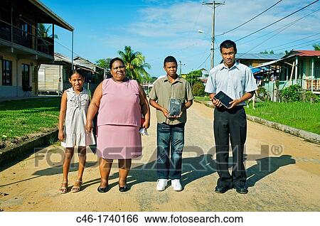 Family going to Church on sunday, Bocas del Toro town, Colon island, Bocas del Toro province, Caribbean sea, Panama. View Large Photo Image Stock Photograph - Family going to Church on sunday, Bocas del Toro town, Colon island, Bocas del Toro province, Caribbean sea, Panama.. Fotosearch