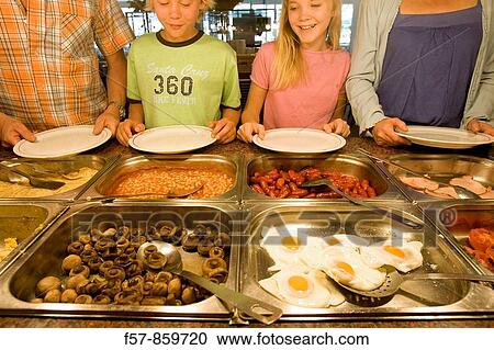 Family having a buffet breakfast View Large Photo Image Stock Image - Family having a buffet breakfast. Fotosearch