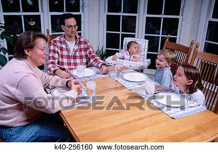 Family having dinner View Large Photo Image Stock Image - Family having dinner. Fotosearch