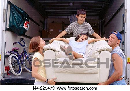 Family helping to carry chair with girl sitting on it View Large Photo Image Stock Photo - Family helping to carry chair with girl sitting on it. Fotosearch