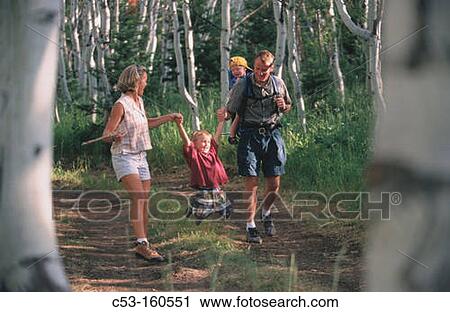 Family hiking in forest View Large Photo Image Stock Image - Family hiking in forest. Fotosearch