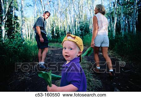 Family hiking in woods View Large Photo Image Stock Image - Family hiking in woods. Fotosearch