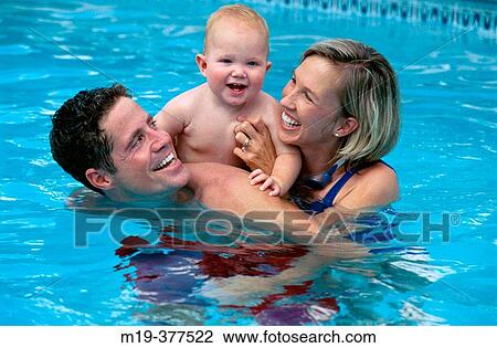 Stock Image - family in a pool. Fotosearch