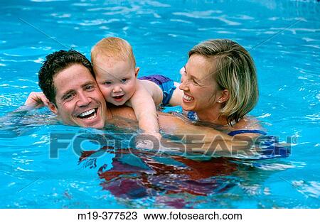 family in a pool View Large Photo Image Stock Image - family in a pool. Fotosearch