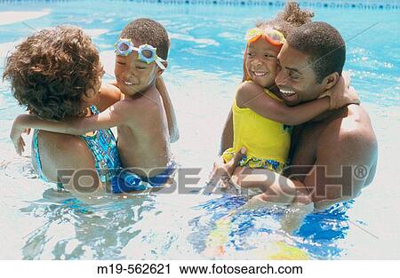 family in a pool View Large Photo Image Stock Image - family in a pool. Fotosearch
