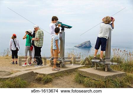 Picture - family in a viewpoint Cap Frehel, C? tes-d? Armor, in northern Brittany, France. Fotosearch