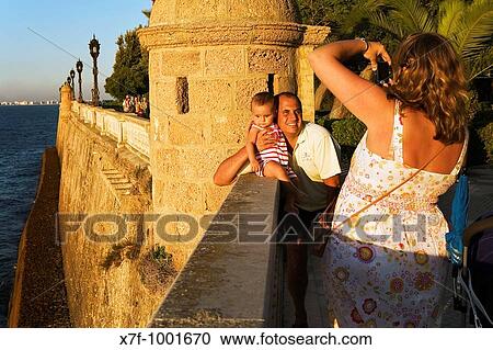 Family in Alameda Apodaca street CBdiz, Andalusia, Spain View Large Photo Image Stock Image - Family in Alameda Apodaca street CBdiz, Andalusia, Spain. Fotosearch