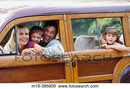 family in an old? woody? station wagon car View Large Photo Image Stock Photo - family in an old? woody? station wagon car. Fotosearch