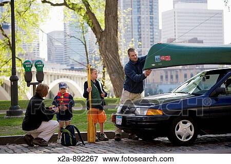 FAMILY IN MINNEAPOLIS PARK View Large Photo Image Stock Photo - FAMILY IN MINNEAPOLIS PARK. Fotosearch