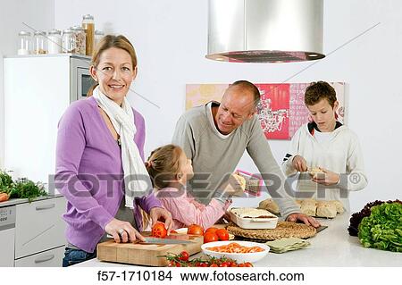 Picture - Family in the kitchen. Fotosearch