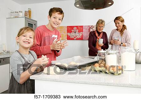 Family in the kitchen View Large Photo Image Stock Image - Family in the kitchen. Fotosearch