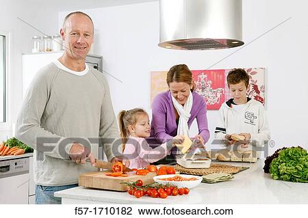 Family in the kitchen View Large Photo Image Stock Image - Family in the kitchen. Fotosearch