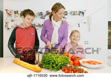 Family in the kitchen View Large Photo Image Stock Image - Family in the kitchen. Fotosearch