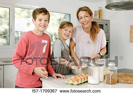 Family in the kitchen View Large Photo Image Stock Photo - Family in the kitchen. Fotosearch