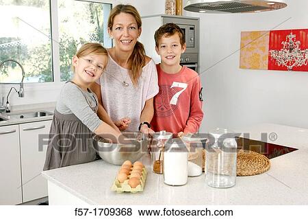Family in the kitchen View Large Photo Image Stock Photo - Family in the kitchen. Fotosearch