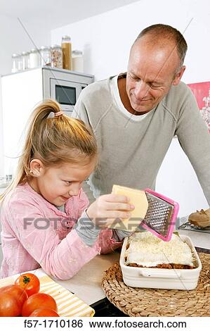 Stock Photograph - Family in the kitchen. Fotosearch