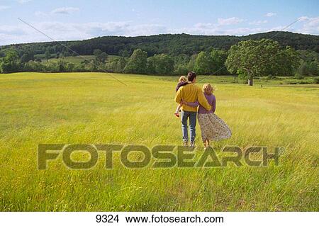 Family in yellow field View Large Photo Image Picture - Family in yellow field. Fotosearch