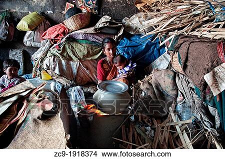 Family living in Mullik ghat flower market Calcutta, West Bengal, India View Large Photo Image Picture - Family living in Mullik ghat flower market Calcutta, West Bengal, India. Fotosearch
