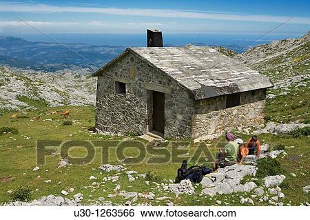 Family next to mountain hut, near to the Ordiales viewpoint, in the Cornion massif, Picos de Europa National Park, Asturias, Spain View Large Photo Image Stock Photograph - Family next to mountain hut, near to the Ordiales viewpoint, in the Cornion massif, Picos de Europa National Park, Asturias, Spain. Fotosearch
