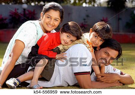Family of four in happy mood. View Large Photo Image Stock Photo - Family of four in happy mood.. Fotosearch