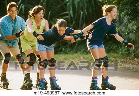 family of four rollerblading View Large Photo Image Stock Photo - family of four rollerblading. Fotosearch
