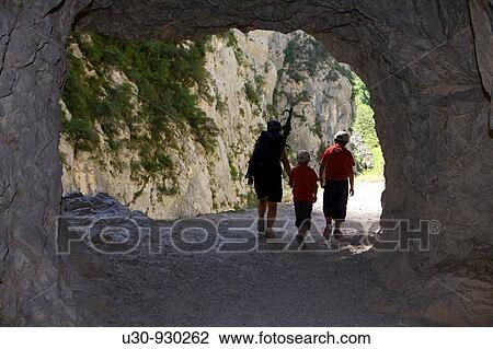 Family of hikers walking along the route of the Cares Canyon, in the Picos de Europa National Park, between the Urrieles and? ndara massifs, Poncebos, Cantabria, Spain View Large Photo Image Stock Image - Family of hikers walking along the route of the Cares Canyon, in the Picos de Europa National Park, between the Urrieles and? ndara massifs, Poncebos, Cantabria, Spain. Fotosearch