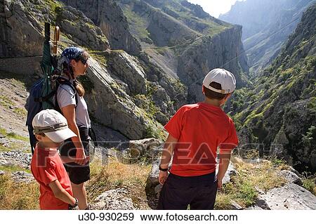 Family of hikers walking along the route of the Cares Canyon, in the Picos de Europa National Park, between the Urrieles and? ndara massifs, Poncebos, Cantabria, Spain View Large Photo Image Stock Photo - Family of hikers walking along the route of the Cares Canyon, in the Picos de Europa National Park, between the Urrieles and? ndara massifs, Poncebos, Cantabria, Spain. Fotosearch