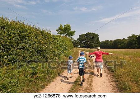 Family on a countryside walk in Benacre, Suffolk, England, Great Britain, Uk View Large Photo Image Stock Photo - Family on a countryside walk in Benacre, Suffolk, England, Great Britain, Uk. Fotosearch