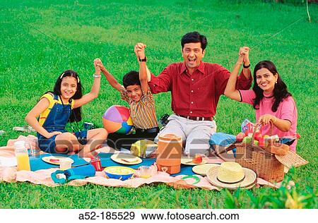 Family on a picnic View Large Photo Image Stock Photo - Family on a picnic. Fotosearch