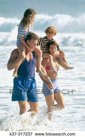 Stock Photo - Family on beach. Cape Town. South Africa. Fotosearch