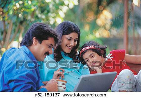 Family on laptop computer View Large Photo Image Stock Photo - Family on laptop computer. Fotosearch