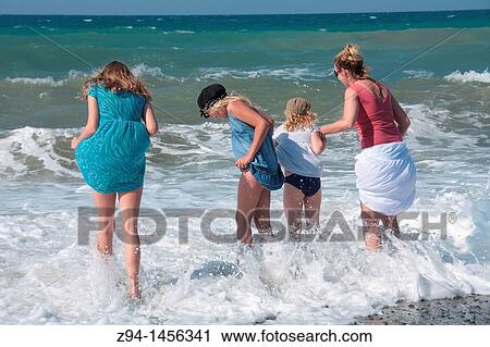 Stock Image - Family on the beach. Fotosearch