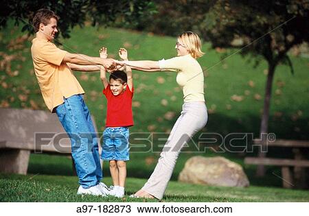 Family outdoors having fun View Large Photo Image Stock Image - Family outdoors having fun. Fotosearch