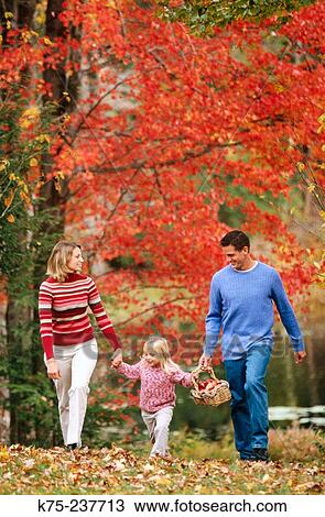 Stock Image - Family outing on a beautiful fall day. Fotosearch