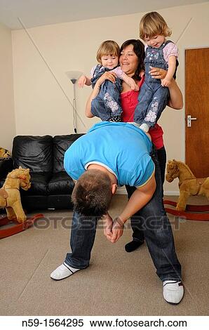 Family playing at home View Large Photo Image Stock Photography - Family playing at home. Fotosearch