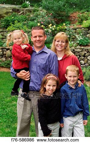 Family portrait, parents with 3 children. View Large Photo Image Stock Photograph - Family portrait, parents with 3 children.. Fotosearch