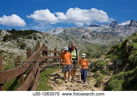 Stock Image - Family practice mountaineering along a route, in the Cornion massif, near to the Covadonga Lakes, in the Picos de Europa National Park, Asturias, Spain. Fotosearch