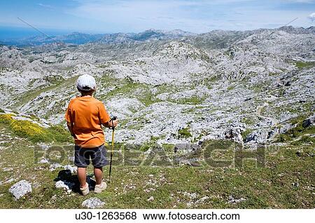 Family practice mountaineering along a route, in the Cornion massif, near to the Covadonga Lakes, in the Picos de Europa National Park, Asturias, Spain View Large Photo Image Stock Photo - Family practice mountaineering along a route, in the Cornion massif, near to the Covadonga Lakes, in the Picos de Europa National Park, Asturias, Spain. Fotosearch